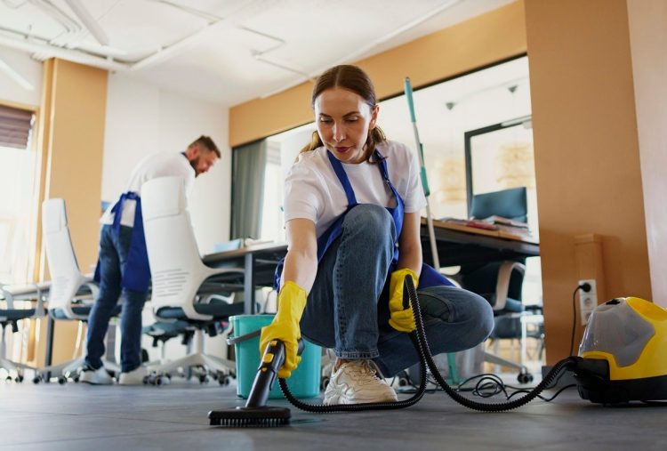 professional-cleaning-service-person-using-vacuum-cleaner-office